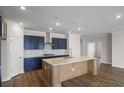 Modern kitchen featuring sleek countertops, stainless steel appliances, and a stylish center island at 5015 Cambria Ct., Little River, SC 29566