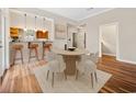 Cozy dining area with modern lighting fixtures and convenient access to the kitchen at 3034 Oak Grove Bend # 34 Ar, Murrells Inlet, SC 29576