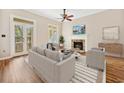 Bright living room with fireplace, wood floors, and access to outdoor balcony at 3034 Oak Grove Bend # 34 Ar, Murrells Inlet, SC 29576