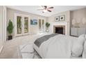 Serene main bedroom features a fireplace, ample sunlight, and outdoor access at 3034 Oak Grove Bend # 34 Ar, Murrells Inlet, SC 29576