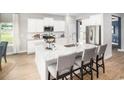 Modern kitchen featuring a large island with seating and granite countertops at 9727 Indigo Creek Blvd., Murrells Inlet, SC 29576