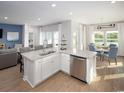 Open concept kitchen with island, stainless steel appliances, and views of a lake at 9727 Indigo Creek Blvd., Murrells Inlet, SC 29576