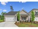 Inviting single-story home with tidy landscaping and a well-maintained front yard at 9742 Indigo Creek Blvd., Murrells Inlet, SC 29576