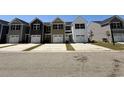 A row of new townhouses shows off their unique front exteriors in this community street view at 258-A Christiana Ln. # A, Myrtle Beach, SC 29579