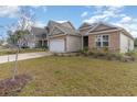House exterior showcasing stone, siding, and landscaping at 808 Flowering Branch Ave., Little River, SC 29566
