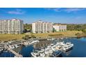 Beautiful aerial view of condos showing the marina, with views of nearby grassy areas and other buildings at 2151 Bridge View Ct. # 2502, North Myrtle Beach, SC 29582