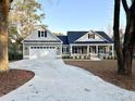Charming home featuring a concrete driveway leading to an attached two-car garage at 1006 Cuttino St., Georgetown, SC 29440