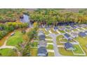 Aerial view of a suburban neighborhood with houses and a river nearby at 131 Grissett Lake Dr., Conway, SC 29526