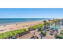 Stunning beach view with pool, boardwalk, and outdoor dining at 2311 S Ocean Blvd. # 438, Myrtle Beach, SC 29577