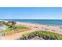 Expansive beach with ocean views, boardwalk, and lounge chairs at 2311 S Ocean Blvd. # 438, Myrtle Beach, SC 29577