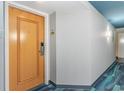 Condo hallway entrance featuring unit number 1408, accent wall, and decorative lighting at 2301 S Ocean Blvd. # 1408, North Myrtle Beach, SC 29582