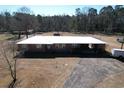 Brick ranch home nestled on a spacious lot with mature trees at 4575 Saints Delight Rd., Georgetown, SC 29440