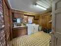 Laundry room with washer, dryer, cabinets, and sink at 4575 Saints Delight Rd., Georgetown, SC 29440