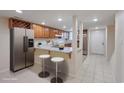 Virtually staged kitchen with granite counters and stainless steel appliances at 6703 Jefferson Pl. # B2, Myrtle Beach, SC 29572