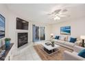 Virtually staged living room with fireplace and patio access at 6703 Jefferson Pl. # B2, Myrtle Beach, SC 29572