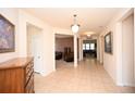 Bright and spacious foyer with tile floors and views into the living room at 101 Hartwell Dr., Little River, SC 29566