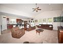 Open concept living room with adjacent kitchen and high ceilings at 101 Hartwell Dr., Little River, SC 29566