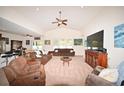 Spacious living room featuring a high ceiling, neutral color palette, and ample natural light at 101 Hartwell Dr., Little River, SC 29566