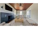 Cozy living room with a black fireplace, wood ceiling, and neutral furniture at 2110 4Th Ave., Conway, SC 29527