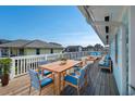 Spacious deck with outdoor dining and seating areas at 243 Calhoun Dr., Garden City Beach, SC 29576