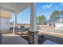 Covered front porch featuring brick pillars, offering a welcoming outdoor space at 2480 Campton Loop, Conway, SC 29527