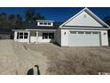 New construction home with white siding and a two car garage at 4646 Quiet Ave., Conway, SC 29527