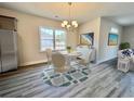 Bright dining area with a large window and elegant lighting, perfect for Gathering meals and gatherings at 4963 Old Highway 90, Conway, SC 29526