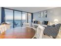 Comfortable living room with ocean view balcony and modern furnishings at 5523 N Ocean Blvd. N # 1410, Myrtle Beach, SC 29577