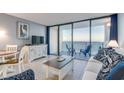 Inviting living area with ocean view, TV, sofa and stylish decor at 5523 N Ocean Blvd. N # 1410, Myrtle Beach, SC 29577