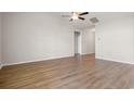 Large open living room with light hard wood flooring and ceiling fan at 1203 Cypress Shoal Dr., Conway, SC 29526