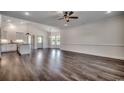 Bright living room featuring wood floors, recessed lighting, crown molding, and seamless transition to the kitchen at 2682 Hugo Rd., Conway, SC 29527