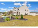 Expansive corner lot with lush landscaping, decorative stone, and an inviting curb appeal at 568 Affinity Dr., Myrtle Beach, SC 29588