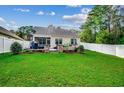 Spacious backyard with a large deck, grassy area and privacy fence at 570 Flowering Branch Ave., Little River, SC 29566