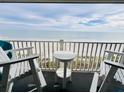 Balcony with ocean view and seating for two at 1317 S Ocean Blvd. # 304, Surfside Beach, SC 29575