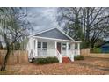 This charming home features a cozy front porch perfect for relaxing outdoors at 108 N Hazard St., Georgetown, SC 29440