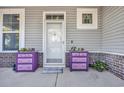 Charming front porch with decorative flower boxes and welcome mat at 217 Astoria Park Loop, Conway, SC 29526
