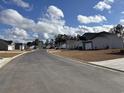 Neighborhood street view showcasing the community's well-maintained roads and neatly arranged homes at 240 Palmetto Sand Loop, Conway, SC 29527