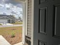 View from the front door showing the exterior facade and landscaping at 300 Palmetto Sand Loop, Conway, SC 29527