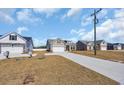 A residential street featuring houses with ample parking and driveways at 432 Hallie Martin Rd., Conway, SC 29527