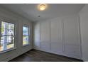Office featuring elegant wall trim, wood floors, and natural light from a large window at 5118 Middleton View Dr., Myrtle Beach, SC 29579