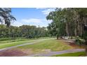 Picturesque golf course view with lush green grass and mature trees at 1969 Governors Landing Rd. # 224, Murrells Inlet, SC 29576