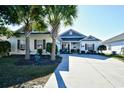 Beautiful single-story home with a two-car garage and landscaped yard at 233 Cloverleaf Dr., Longs, SC 29568