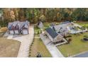 Wide aerial view of a neighborhood with homes, outbuildings, landscaping, and long driveways at 104 Chapel Ridge Circle, Myrtle Beach, SC 29588