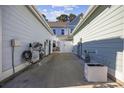 View of the alley between townhouses with utilities and landscaping at 2523 Blue Crane Circle # 102, Myrtle Beach, SC 29577