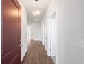 Hallway featuring hardwood floors and neutral paint, with a clear view to other areas at 2472 Campton Loop, Conway, SC 29527