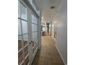 Inviting hallway with tile flooring leading to a view of the kitchen and living spaces at 620 Sunnyside Dr. # 102, Murrells Inlet, SC 29576