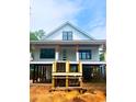 Charming new construction with a raised foundation and a covered porch, offering elevated living and curb appeal at 314 Hollywood Dr. S, Surfside Beach, SC 29575