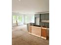 Bright, unfinished kitchen featuring gray cabinets, large windows, and lots of natural light, perfect for a modern design at 314 Hollywood Dr. S, Surfside Beach, SC 29575
