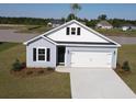 Attractive single-Gathering home with black shutters, a lawn, and a convenient two-car garage at 1044 Jase Dr., Longs, SC 29568
