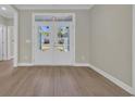 Bright living area with hardwood floors and stylish glass doors at 2515 Saint Andrews Dr., Little River, SC 29566